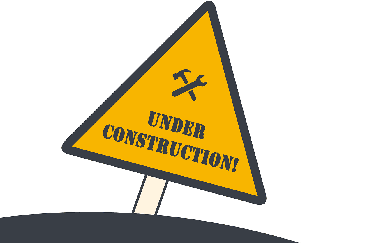 A yellow sign with the words under construction written on it.